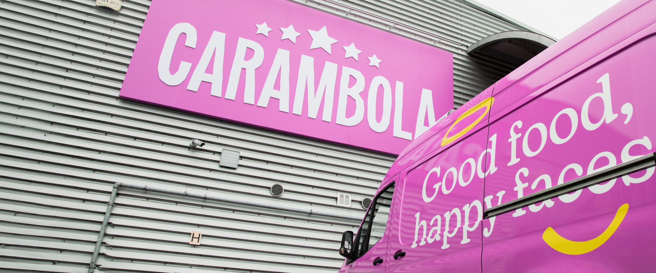 Carambola's pink van outside HQ
